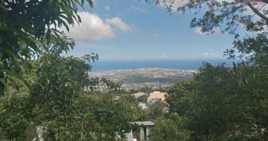 a vendre terrain de 400 m2 à bois de nefles saint-paul avec vue sur mer